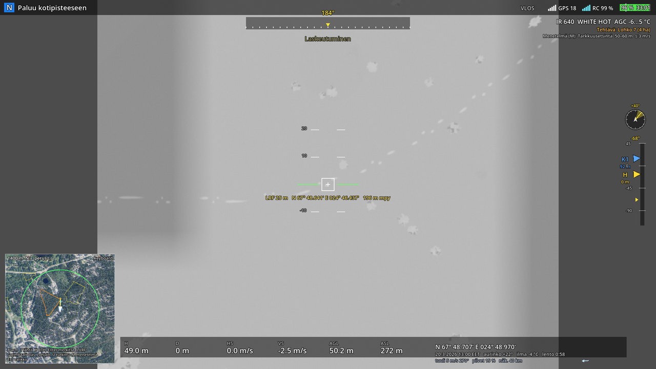The thermal camera full screen (640 × 512, White hot): fresh tracks in snow show warm, a boulder warms in the sun.